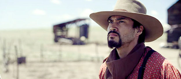 Martin Sensmeier as Montford T. Johnson, watching a Union cavalry patrol approach his ranch yet again in Montford, The Chickasaw Rancher (2021)