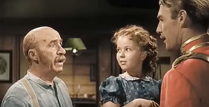 J. Farrell MacDonald as Pat O'Hannegan, Shirley Temple as Susannah Sheldon and Randolph Scott as Agnus 'Monty' Montague in Susannah of the Mounties (1939)