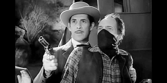 Reed Hadley as the Abilene Kid, trying to foil a stage holdup in Rimfire (1949)