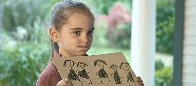 Brooklyn Popp as Angel, showing off one of her drawings to the girls in Bordello (2023)