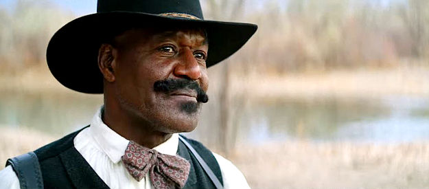 Delroy Lindo as Bass Reeves, a lawman willing to turn a blind eye in return for the demise of Rufus Buck in The Harder They Fall (2021)