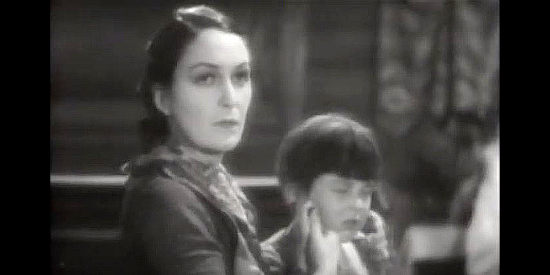 Dorothy Cumming as Cora, her jealousy instantly aroused upon Letty's arrival at her home in The Wind (1928)