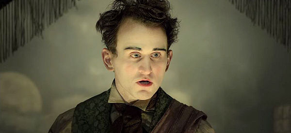 Harry Melling as Harrison, the entertainer with no legs or no arms who serves as a meal ticket in The Ballad of Buster Scruggs (2018)