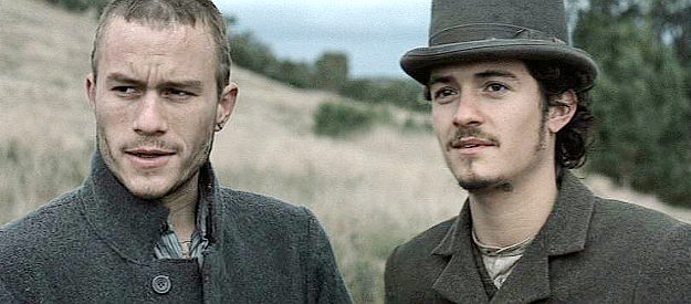 Heath Ledger as Ned Kelly reviewing the state of affairs with friend Joe Byrne (Orlando Bloom) after being released from prison in Ned Kelly (2003)