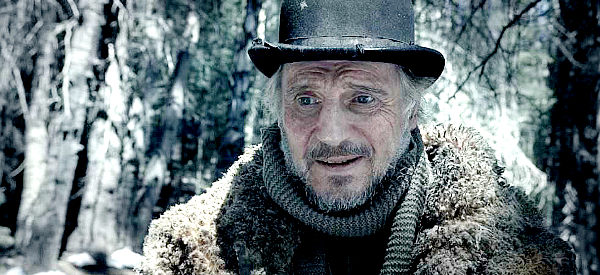 Liam Neeson as the Impresario, worried about the diminishing returns brought in by his meal ticket in The Ballad of Buster Scruggs (2018)