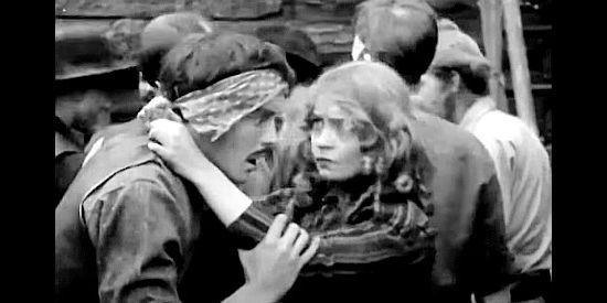 Lillian Gish as Melissa Harlow frantically questioning her husband (Robert Harron) about their child's whereabouts in The Battle of Elderbush Gulch (1913)