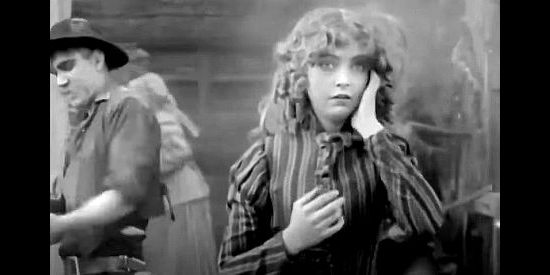 Lillian Gish as Melissa Harlow frets about what's happened to her child while the men try to defend the ranch house in The Battle of Elderbush Gulch (1913) 