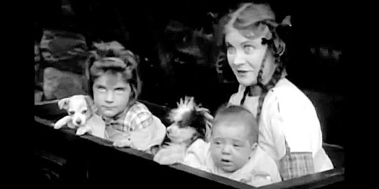 Mae Marsh (right) as Sally Cameron and her little sister (Leslie Loveridge) emerging from a hiding place in The Battle of Elderbush Gulch (1913)