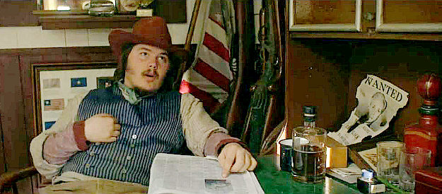 Maximillian Osterholtz as Sheriff Peters, learning the Cripple Dog gang is in his town in Peacemaker (2023)