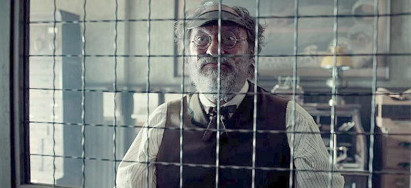 Stephen Root as the bank teller bragging about what happened the first two times someone tried to rob his bank in The Ballad of Buster Scruggs (2018)