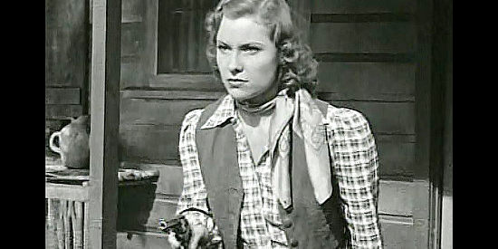 Betty Miles as Ellen Brandon, trying to chase tax collectors off her dad's land in The Return of Daniel Boone (1941)