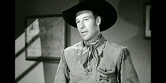Bill Elliott as Wild Bill Boone, hatching a plan to stop the scheming in The Return of Daniel Boone (1941)