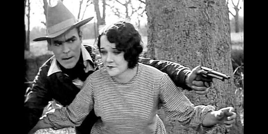 Doris Chadwick as Mary Merrell, helping Harry Tracy (Jack Hoey) escape a lynch mob in Tracy the Outlaw (1928)