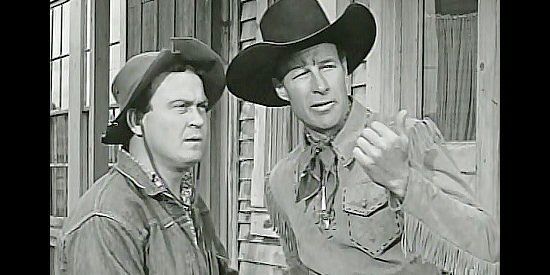 Dub Taylor as Cannonball and Bill Elliott as Wild Bill Boone, discussing a plan to nab the land grabbers in The Return of Daniel Boone (1941)