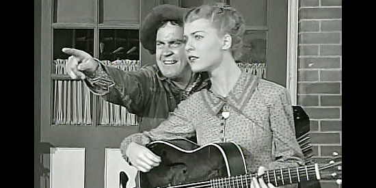 Dub Taylor as Cannonball, trying to distract Melinda (Verda Rodik) with a story about her brother in The Return of Daniel Boone (1941)