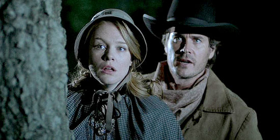 Erin Cottrell as Missie LaHaye and Victor Browne as Sheriff Zach Taylor, concerned about Belinda's safety in Love's Unending Legacy (2007)