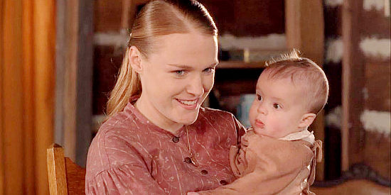 Erin Cottrell as Missie LaHaye, holding her infant daughter Kathy in Love's Abiding Joy (2006)