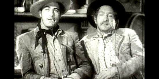 Gilbert Roland as Arizona and J. Carrol Naish as Rafael Lopez, contemplating a showdown with the Tates in Thunder Trail (1937)