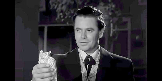 Glenn Ford as Jacob Walz, spruced up and smitten by Julia Thomas, just as she intended in Lust for Gold (1949)