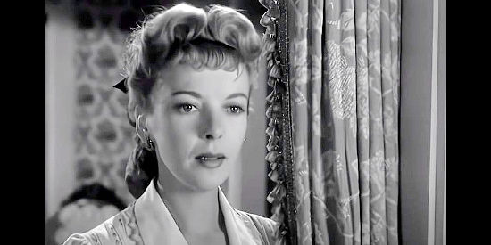 Ida Lupino as Julia Thomas, hatching her plan to get her hands on Jacob Walz's fortune in Lust for Gold (1949)