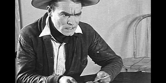 Jack Hoey as Harry Tracy, realizing he's being cheated in Tracy the Outlaw (1928)