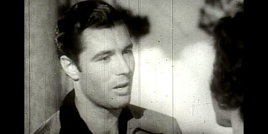 James Craig as Bob Craig, trying to convince Amy Morgan she's misjudged his father in Thunder Trail (1937)