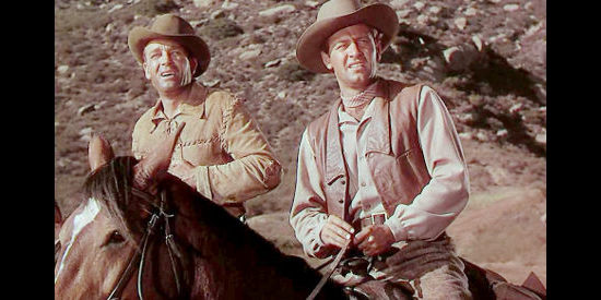 James Millican as Sgt. Jericho Howard and William Holden as Del Stewart, realizing they're too late to help a colleague in The Man from Colorado (1948)