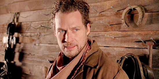 James Tupper as Henry Kline, a close friend of Willie, in danger of losing his home to foreclosure in Love's Abiding Joy (2003)