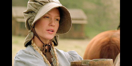 January Jones as Missie Davis, bringing water to Nate as he works in her family's field in Love's Enduring Promise (2004)