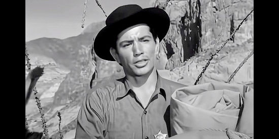 Jay Silverheels as Deputy Walker, one of Sheriff Early's two deputies trying to help solve a string of murders in Lust for Gold (1949)