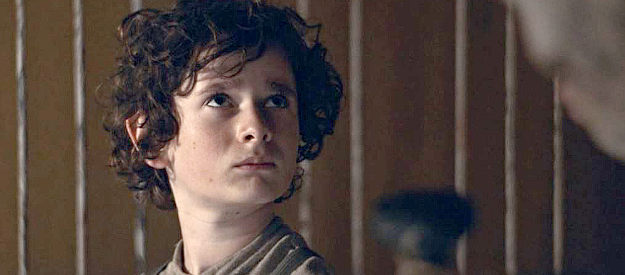 Jonah Collier as young Billy, looking forward to the adventure of a trip West in Billy the Kid (2022)