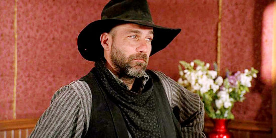 Kevin Gage as John Abel, right-hand man for Mayor Samuel Doros in Love's Abiding Joy (2006)