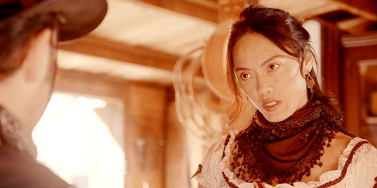 Linda S. Wong as Rita, giving a not-so-warm welcome to Nico Raines on his return to Monterey in American Western (2022)