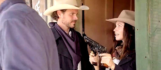 Lisa Barnes as Belle MacLure, teasing William Cole (Beau Yotty) after snagging a bounty he was after in For the Reward (2022)