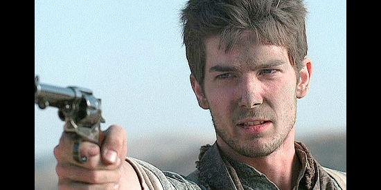 Logan Bartholomew as Willie LaHaye, prepared to defend his ranch in Love's Long Journey (2005)