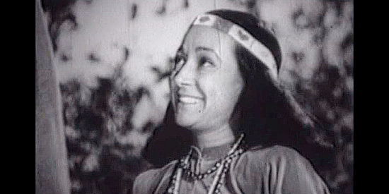 Marion Carney as Okeeman, making her affection for Navo clear in Daughter of the West (1949)