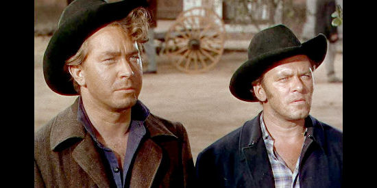 Mikel Conrad as Morris and William Phillips as York, two of the soldiers who return home to find someone else claiming ownership of their mines in The Man from Colorado (1948)
