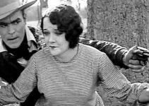 Doris Chadwick as Mary Merrell, helping Harry Tracy (Jack Hoey) escape a lynch mob in Tracy the Outlaw (1928)