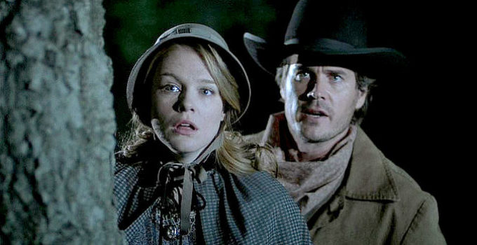 Erin Cottrell as Missie LaHaye and Victor Browne as Sheriff Zach Taylor, concerned about Belinda's safety in Love's Unending Legacy (2007)