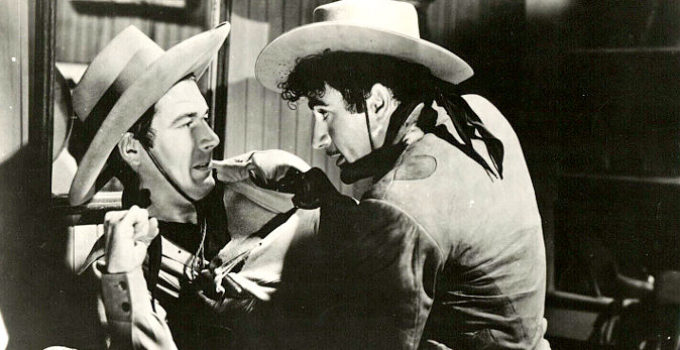 James Craig as Bob Tate and Gilbert Roland as Dick Ames in Thunder Trail (1937)