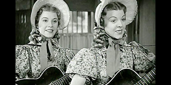 The Rodik Twins as Melinda and Matilda, serenade Cannonball in The Return of Daniel Boone (1941)