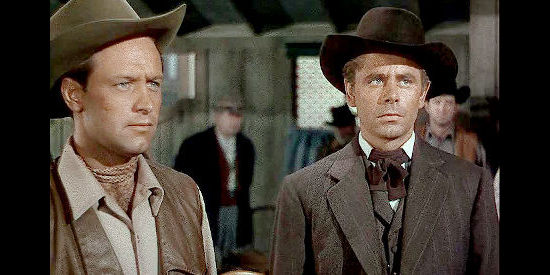 William Holden as Del Stewart and Glenn Ford as Owen Devereaux, questioning one of their former soldiers in The Man from Colorado (1948)
