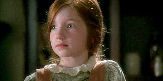 Annalise Basso as Lillian, an orphan helping care for her sick friends in Love Takes Wing (2009)