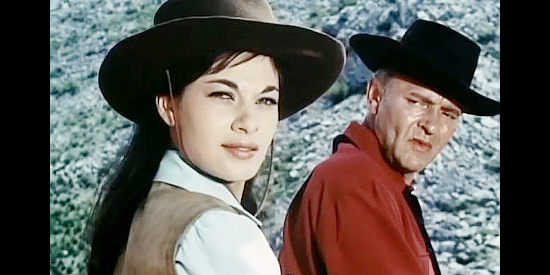 Carole Gray as Nancy Greenwood and Peter van Eyck as Don McDow, surprised as a posse approaches in Duel at Sundown (1965)