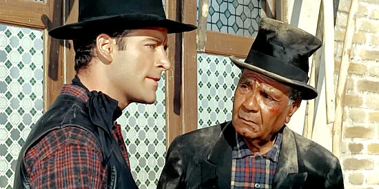 George Martin as Billy Carter with Sam, one of his dad's workers who's being bullied by Black and his men in Billy the Kid (1964)