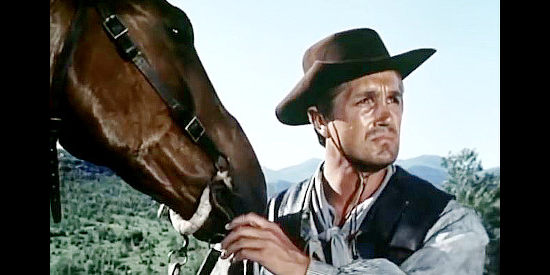 Giacomo Rossi-Stuart as Quents, a McDow ranch hand, watching the quarreling brothers in Duel at Sundown (1965)