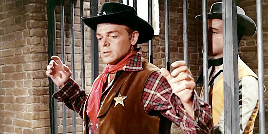 Lorenzo Robledo as Deputy Jim, outwitted as Billy Carter prepares to escape jail in Billy the Kid (1964)