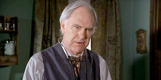 Robert Pine as Dr. Micah Jackson, expressing doubt about taking on a female assistant in Love's Unfolding Dream (2007)