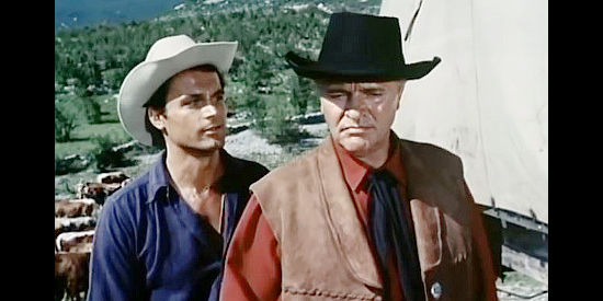 Terence Hill (Mario Girotti) as Larry McDow and Peter van Eyck as his older brother Don, arguing about where a herd should be bedded down in Duel at Sundown (1965)