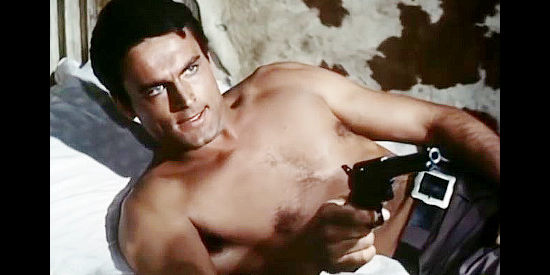 Terence Hill (Mario Girotti) as Larry McDow, blasting the cuckoo clock that wakes him up in Duel at Sundown (1965)